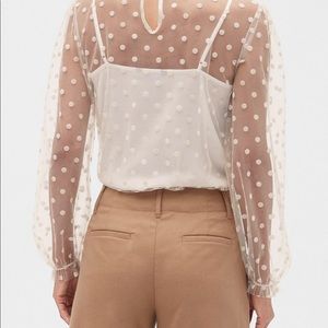 See through white polka dot shirt with tie neck